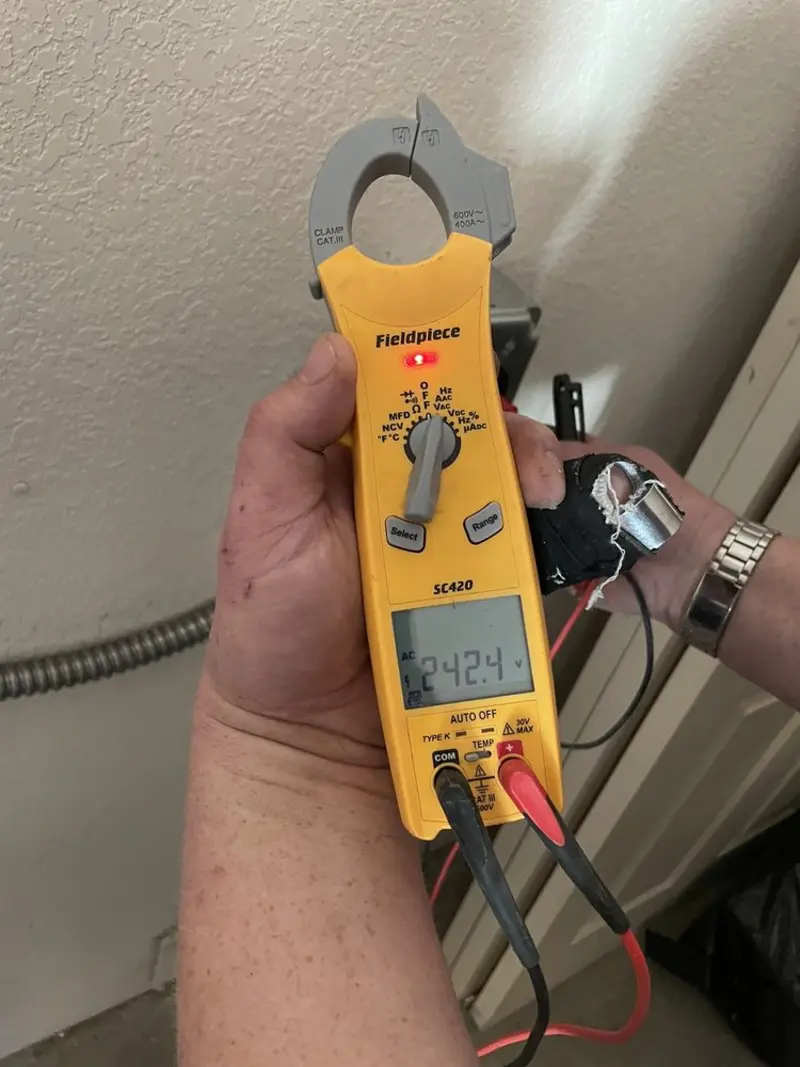 Voltage testing with clamp meter during Ceiling Fan Installation in Thomaston
